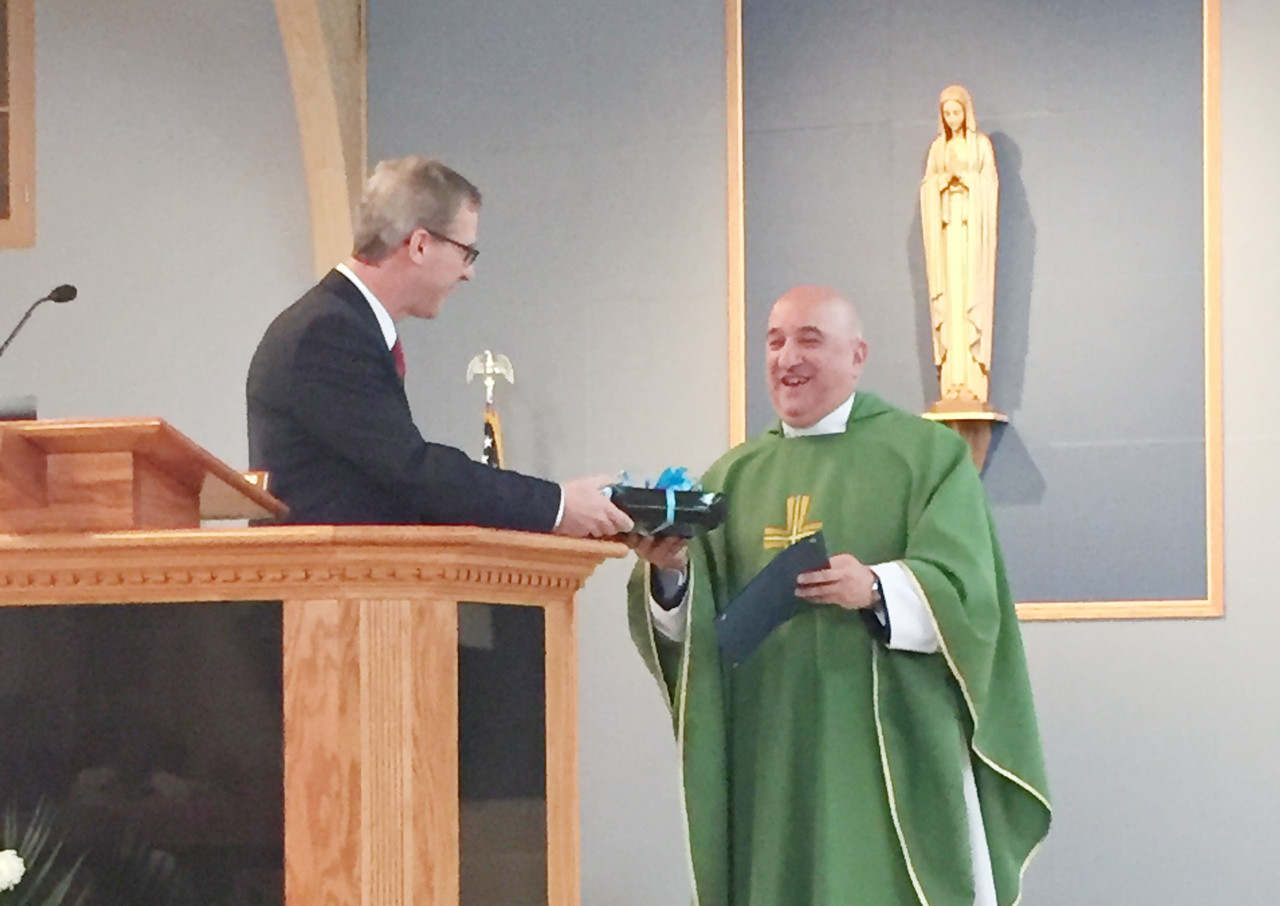 Father Robert Marciano, pastor of St. Kevin Parish and School, was presented with the Distinguished School Pastor Award during a parish Mass on Sunday, January 31. “He believes in the gift of a Catholic education and does whatever it takes to help families give that gift to their children,” said Ferris.