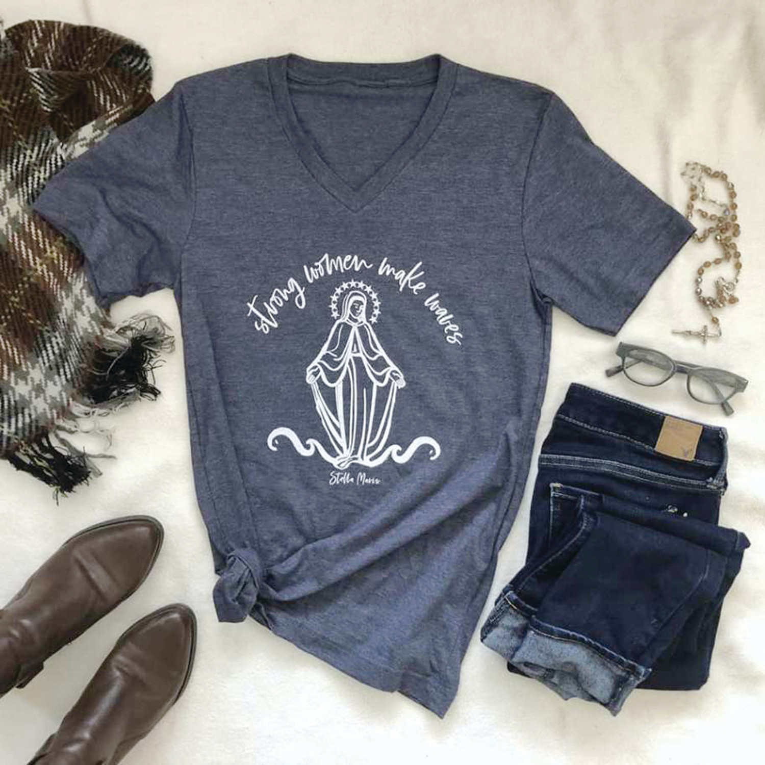 A shirt design by Lauren Winter pays tribute to the Blessed Mother’s life and example. “She made a tidal wave so grand that its ripple effects have lasted for millenniums and will continue to for all eternity,” said Winter.