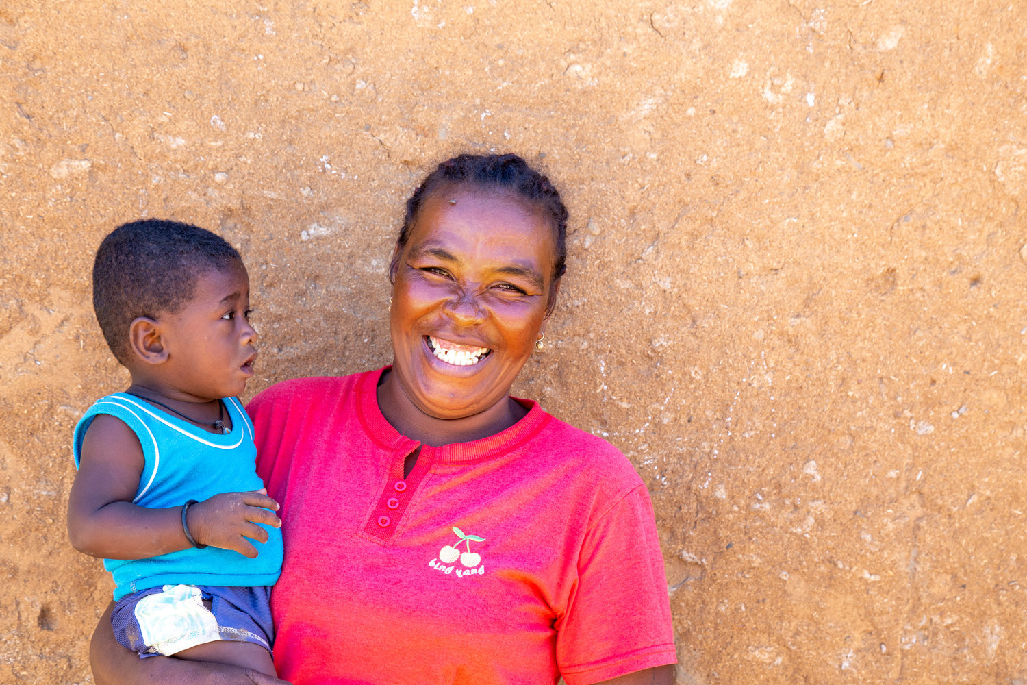 Frankline Fanomezantsoa Rasoanandrasana, 41, lead mother for the CLTN (Community-Led Total Nutrition) project, and her son Thorin, 11 months, by their home in Miary Ankoranga village, Miary commune, Toliara district, Madagascar.