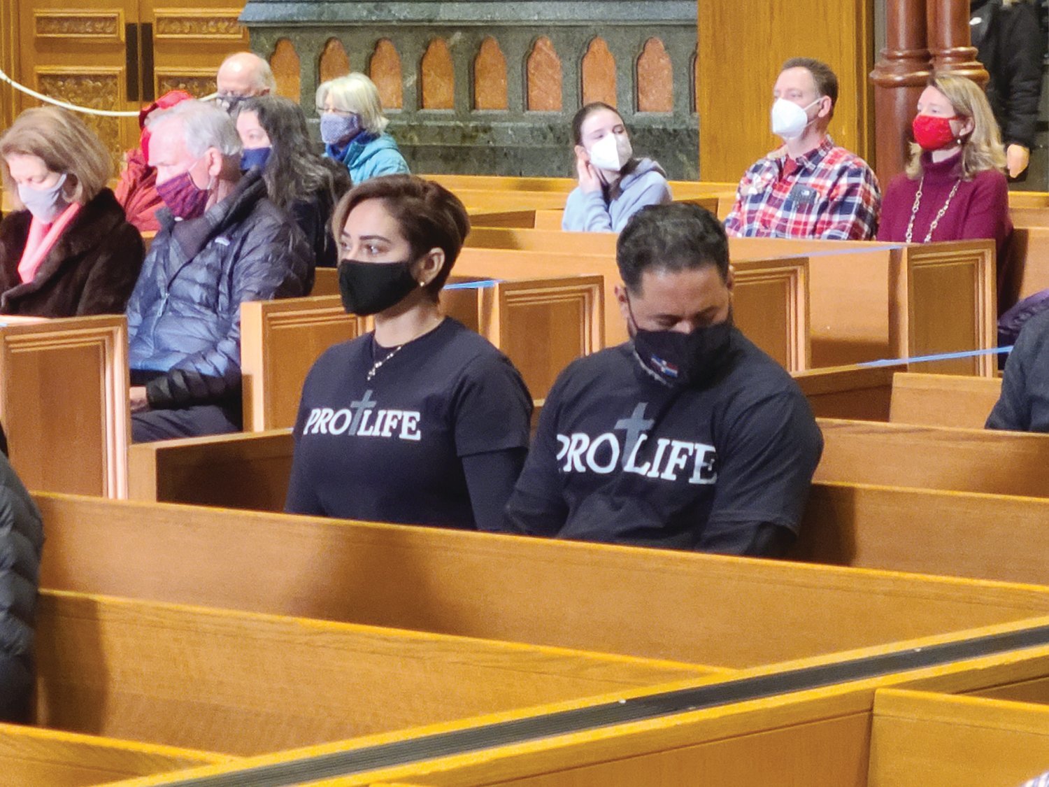 Juan Luzon and his wife Iris Luzo, parishioners of St. Charles Borromeo Church in Providence, look on during the Respect Life Mass.