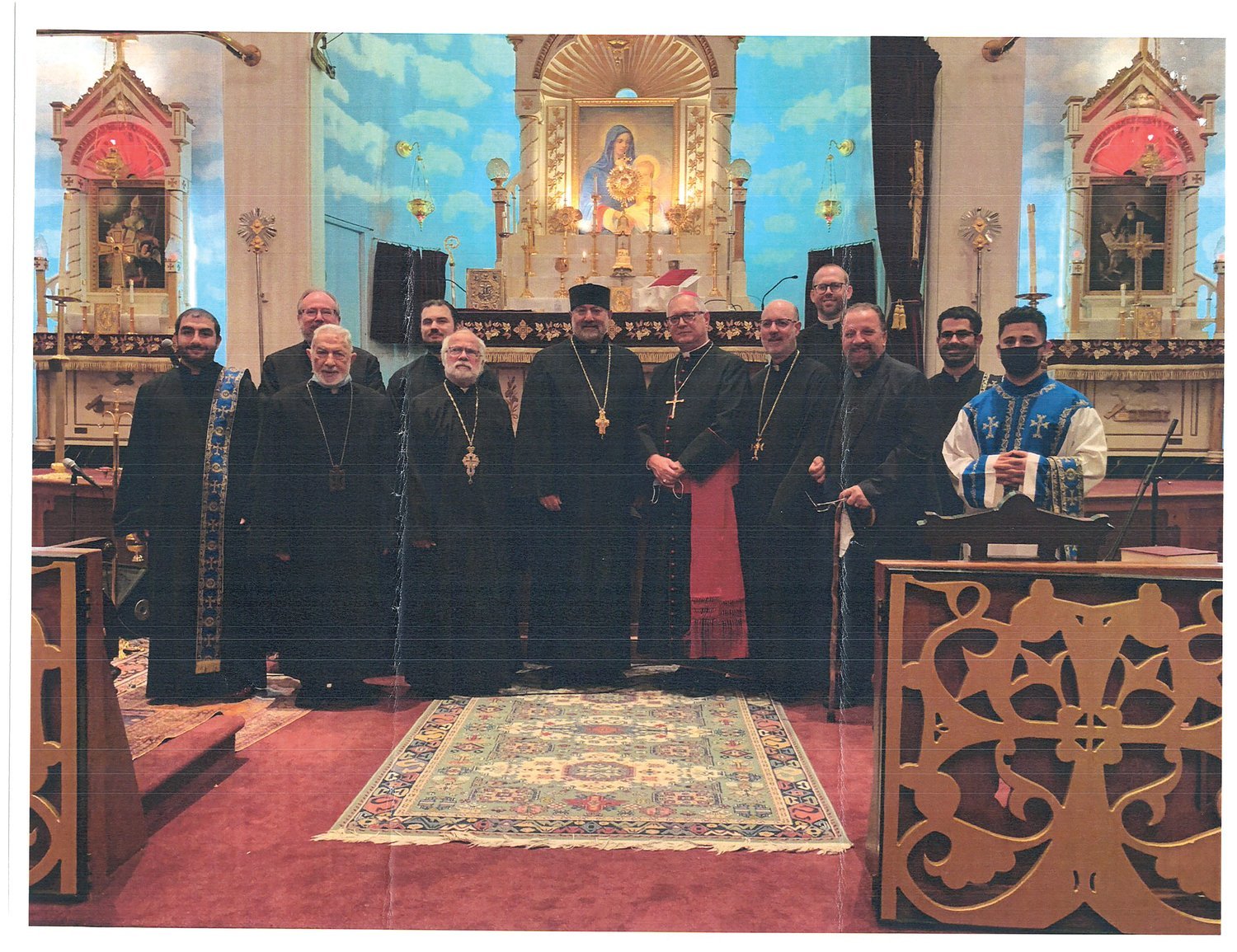 Pictured above, from left: Deacon Megrdichian, Father Joseph Santos, Father Nerses Jebejian, Father Nick Lanzourakis, Father Andrew George, Father Shnork Souin, Bishop Thomas J. Tobin, Father Kapriel Nazarian, Father Adam Young, Rev. Hagop Manjelikian, Deacon Michael Sabounjian, SDn. Aren Dawood. The participants wore masks for the service, removing them briefly for the photo.