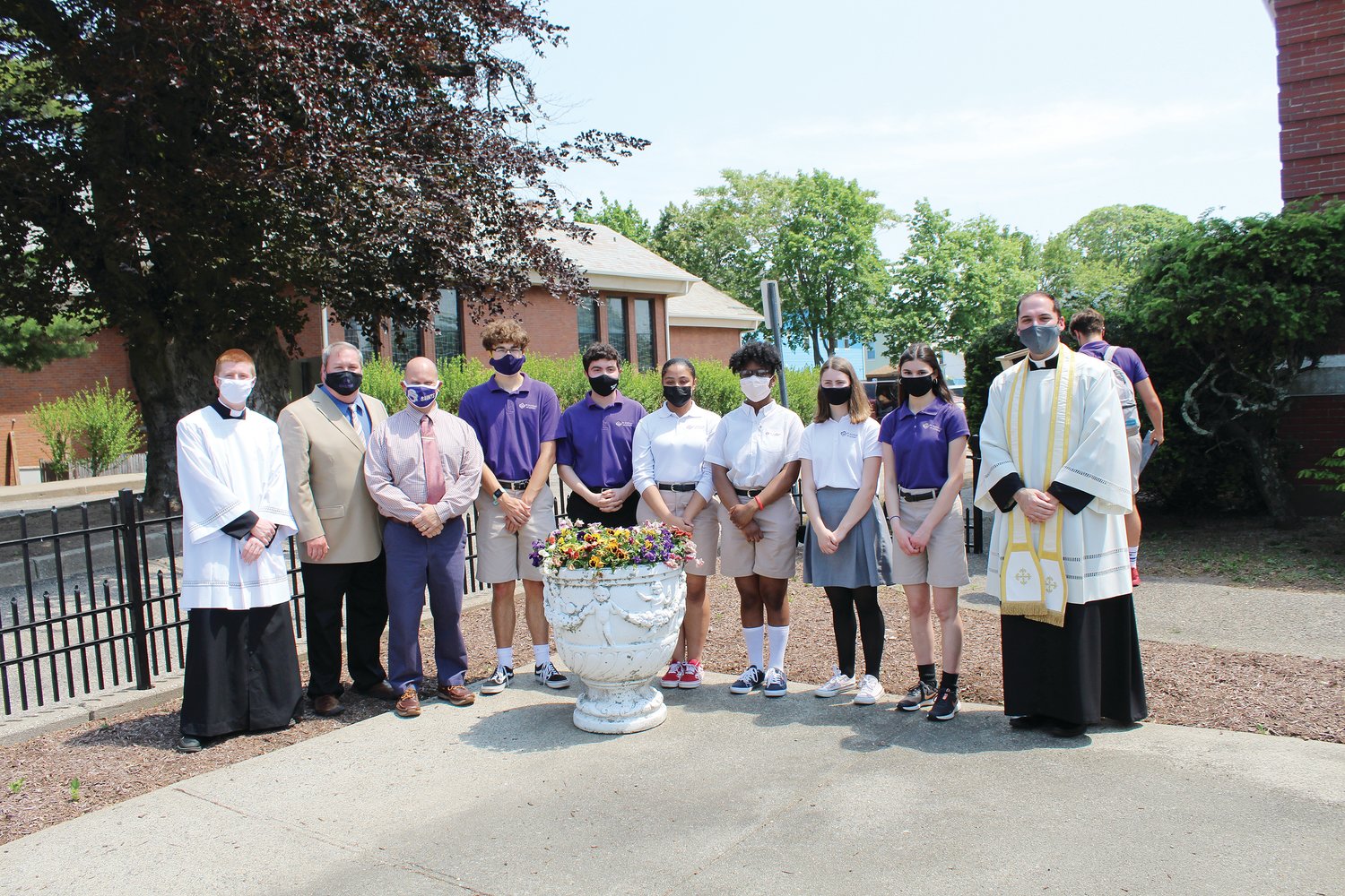 Pictured are seminarian Jay Zizzo, Steve Vargas, Vice Principal of Student Life Marc Thibault, students Josh Farrell, David Wilson, Natalya Cabral, Ralphletha Flowers, Clare Bradley, Isabel Sullivan and Academy Chaplain Father Ryan Simas.