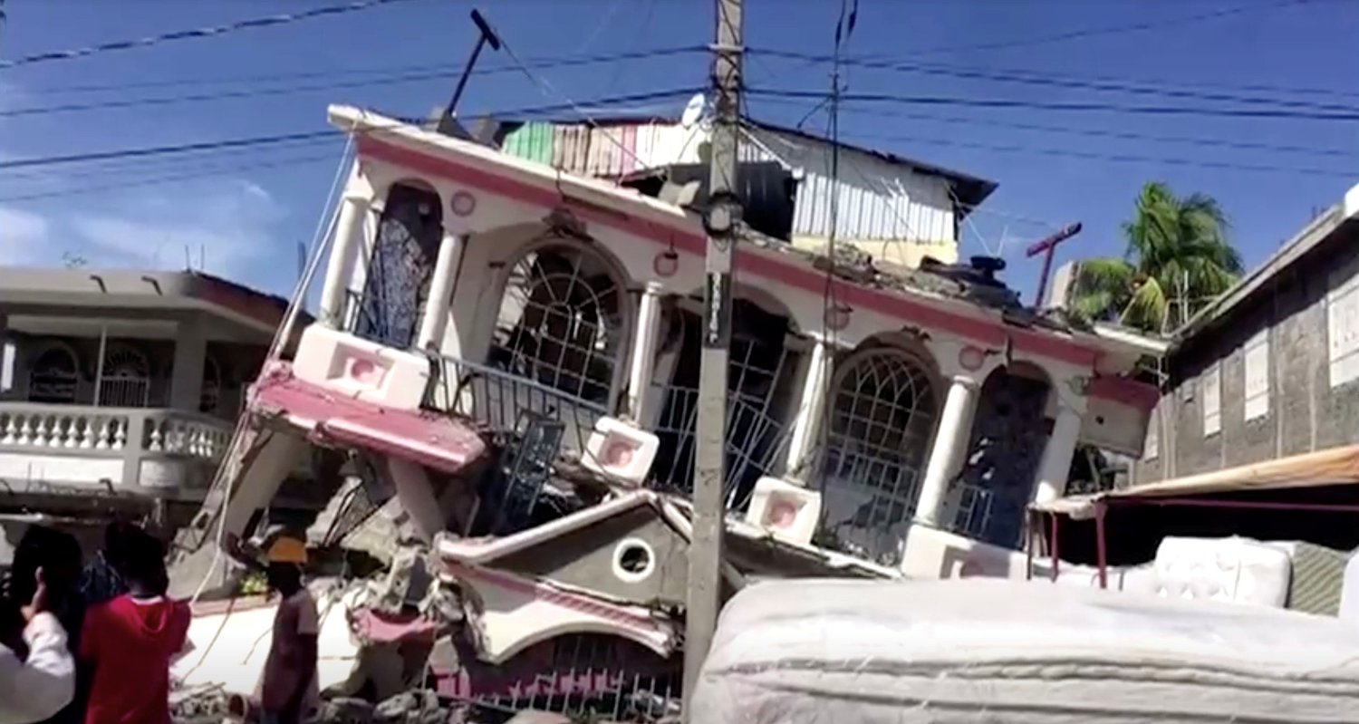 A collapsed building is pictured following an earthquake, in Les Cayes, Haiti, in this still image taken from a video Aug. 14, 2021. At least 29 people are dead after the magnitude 7.2  earthquake shook Haiti. Haitian Prime Minister Ariel Henry has declared a state of emergency, which will last for one month.