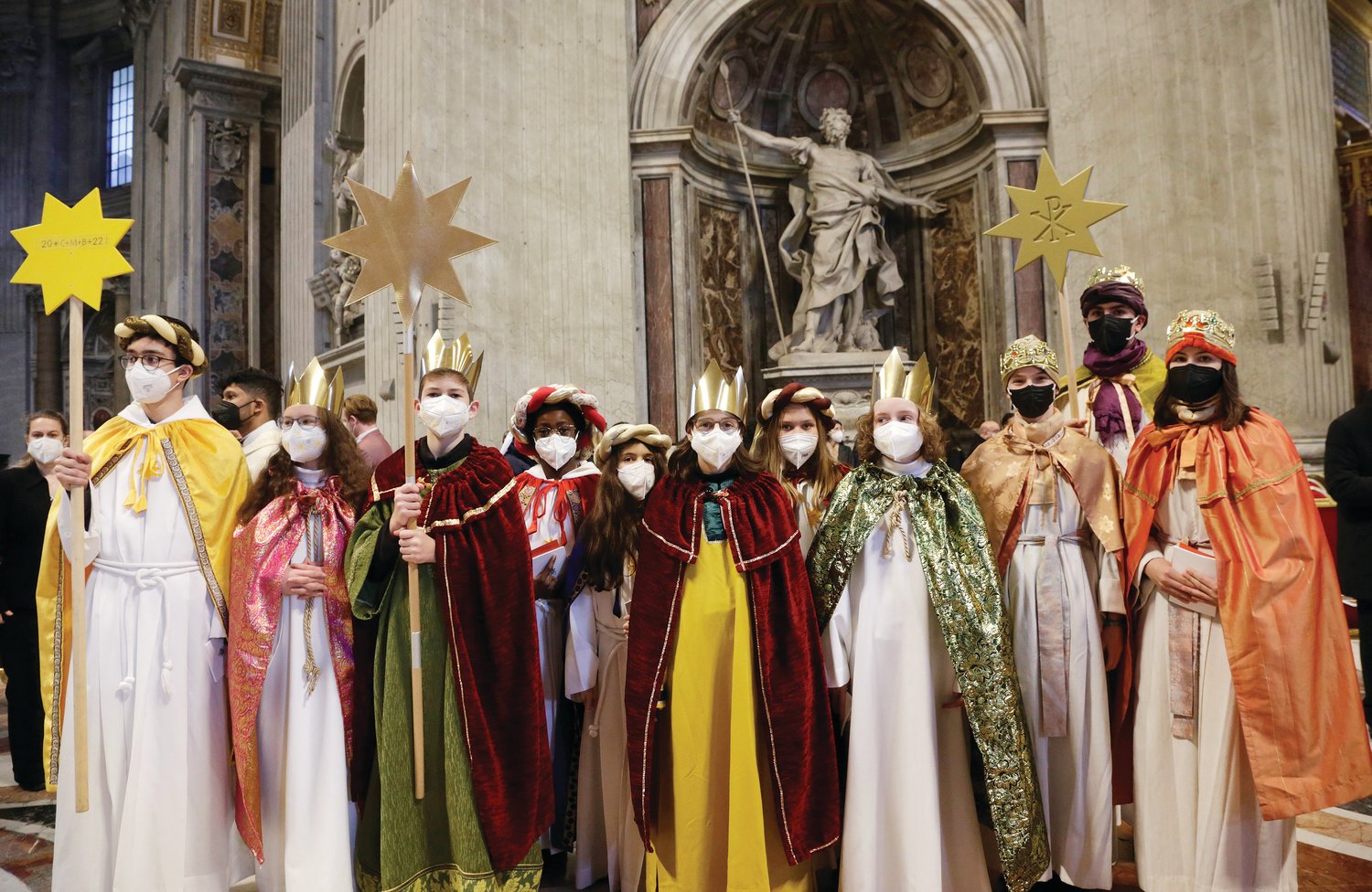 Young people dressed as the Magi are pictured after attending Pope Francis' celebration of Mass on the feast of Mary, Mother of God, at the Vatican Jan. 1, 2022. German, Italian and Swiss young people, called "sternsingers," carol and raise money for charity between Christmas and Epiphany each year.