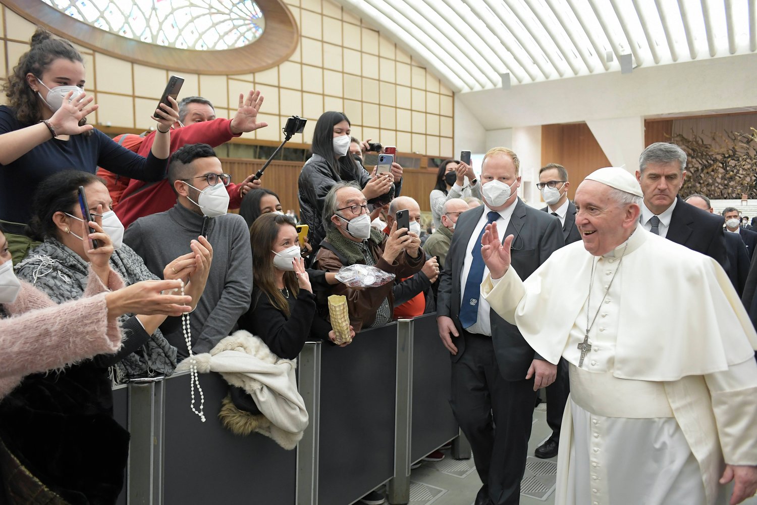Pope Francis greets people during his general audience in the Paul VI hall at the Vatican Feb. 9, 2022. (CNS photo/Vatican Media)