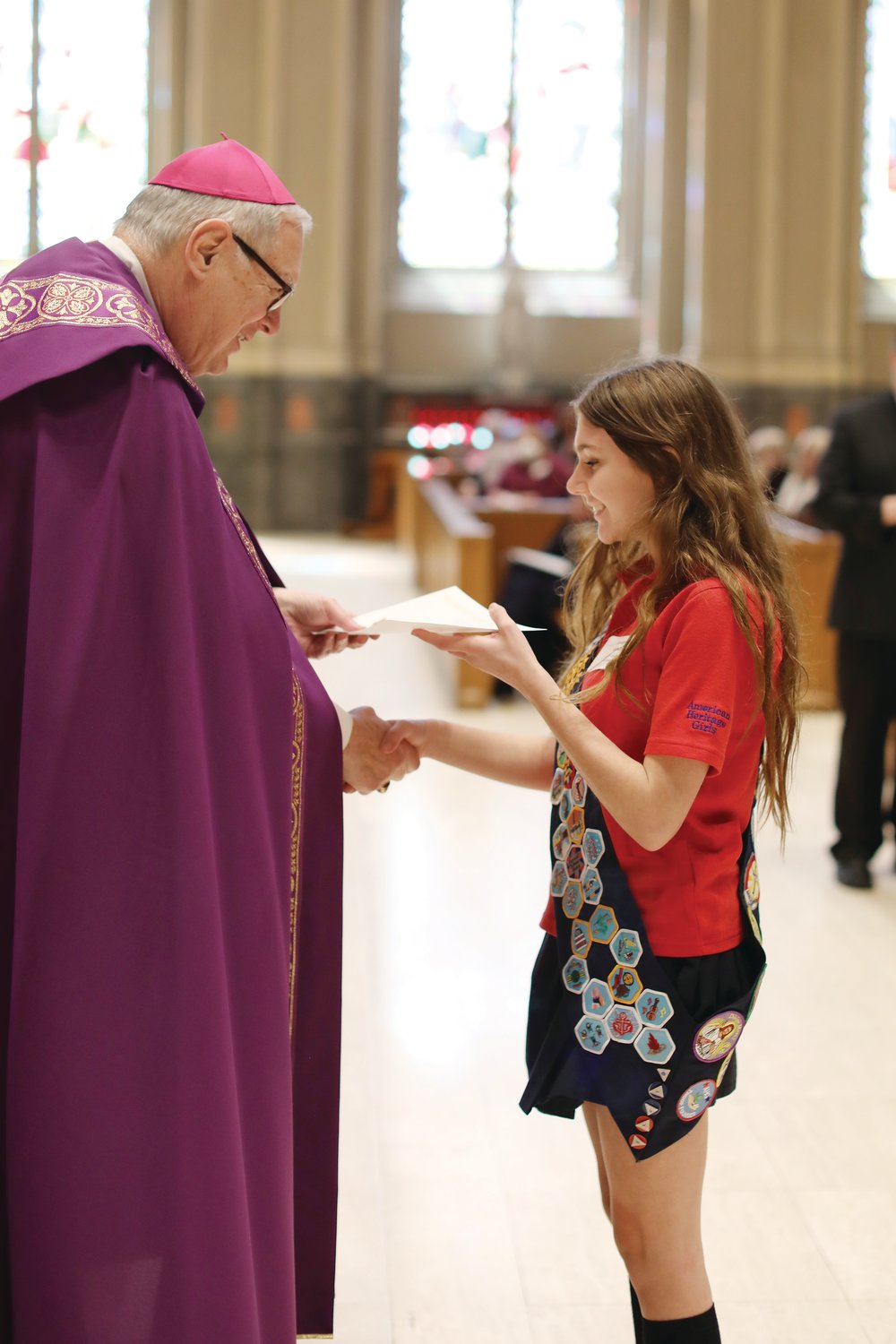 Local youth and adult volunteers were honored at this year’s diocesan Catholic Youth Ministry and Scout Awards, held at the Cathedral of SS. Peter and Paul on Sunday, March 13. At right, American Heritage Girl Amanda Abbott, of SS. Rose and Clement, Warwick, was the recipient of the 2022 Pillars of Faith Award, which recognizes Scouts who earn all four National Catholic Religious Scouting Awards: The Family of God; I Live My Faith; Mary, the First Disciple; and The Spirit Alive.