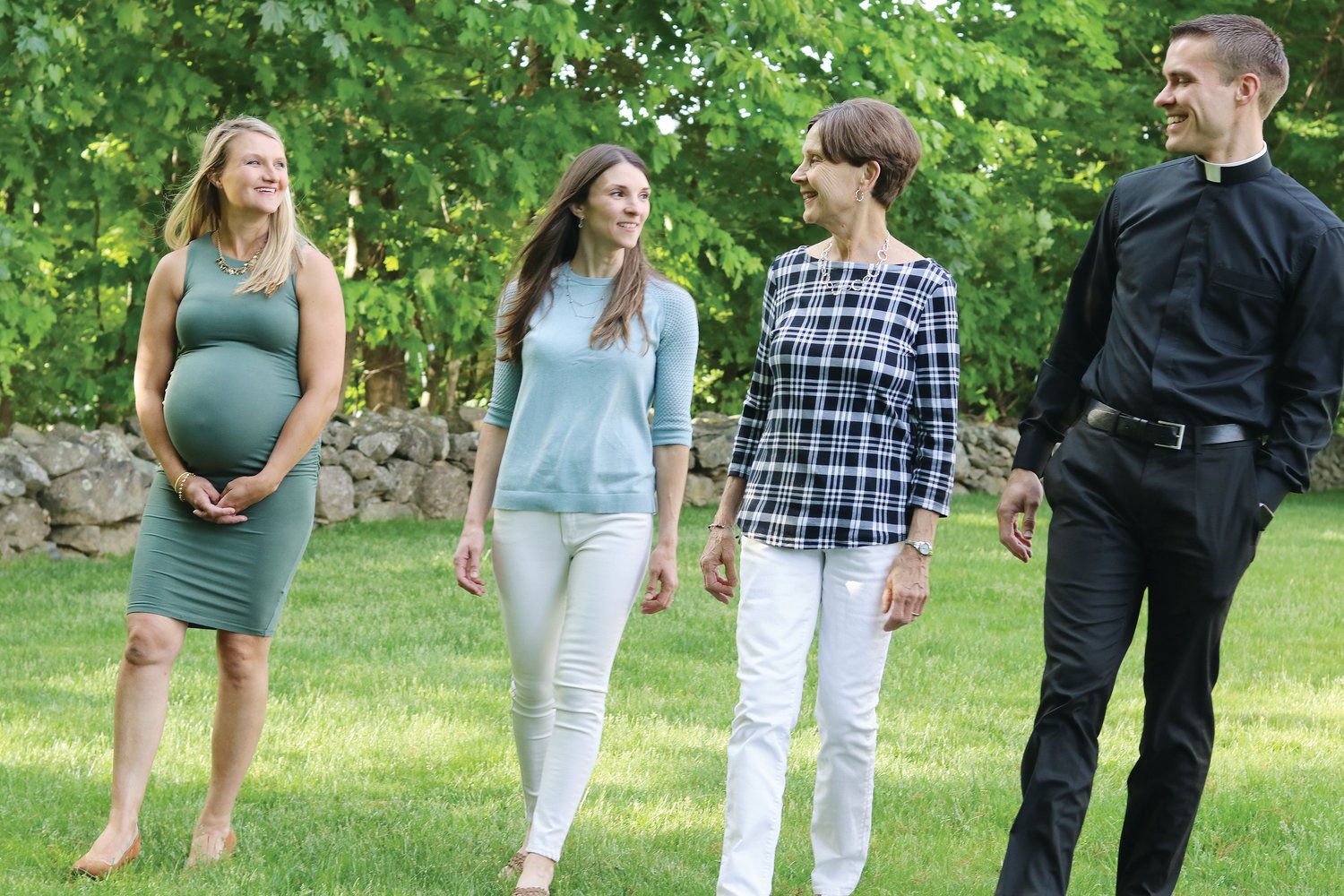 Deacon Mark Gadoury shares some laughs with his sisters Rebecca, left, and Rachel, along with their mother Cheryl during an evening stroll last week in the backyard of the beloved Cumberland home where the siblings grew up. Deacon Gadoury will be ordained to the priesthood on Saturday, June 4, at 10 a.m., at the Cathedral of SS. Peter and Paul.
