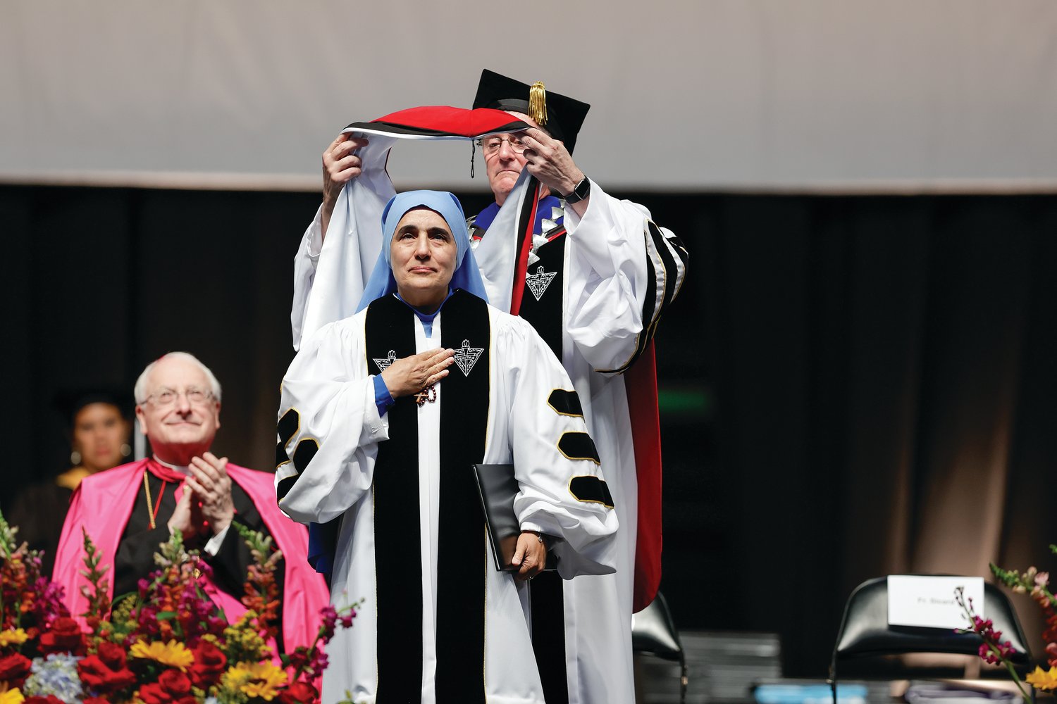 Mother Olga receives her honorary doctorate at PC’s recent commencement.