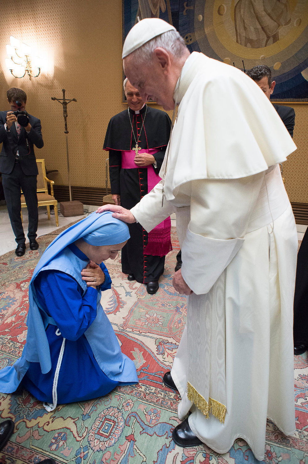 Mother Olga of the Sacred Heart is the founder and mother servant of the Daughters of Mary of Nazareth, a Roman Catholic religious order in the Archdiocese of Boston. At left, Pope Francis offers a blessing upon Mother Olga during a visit together.