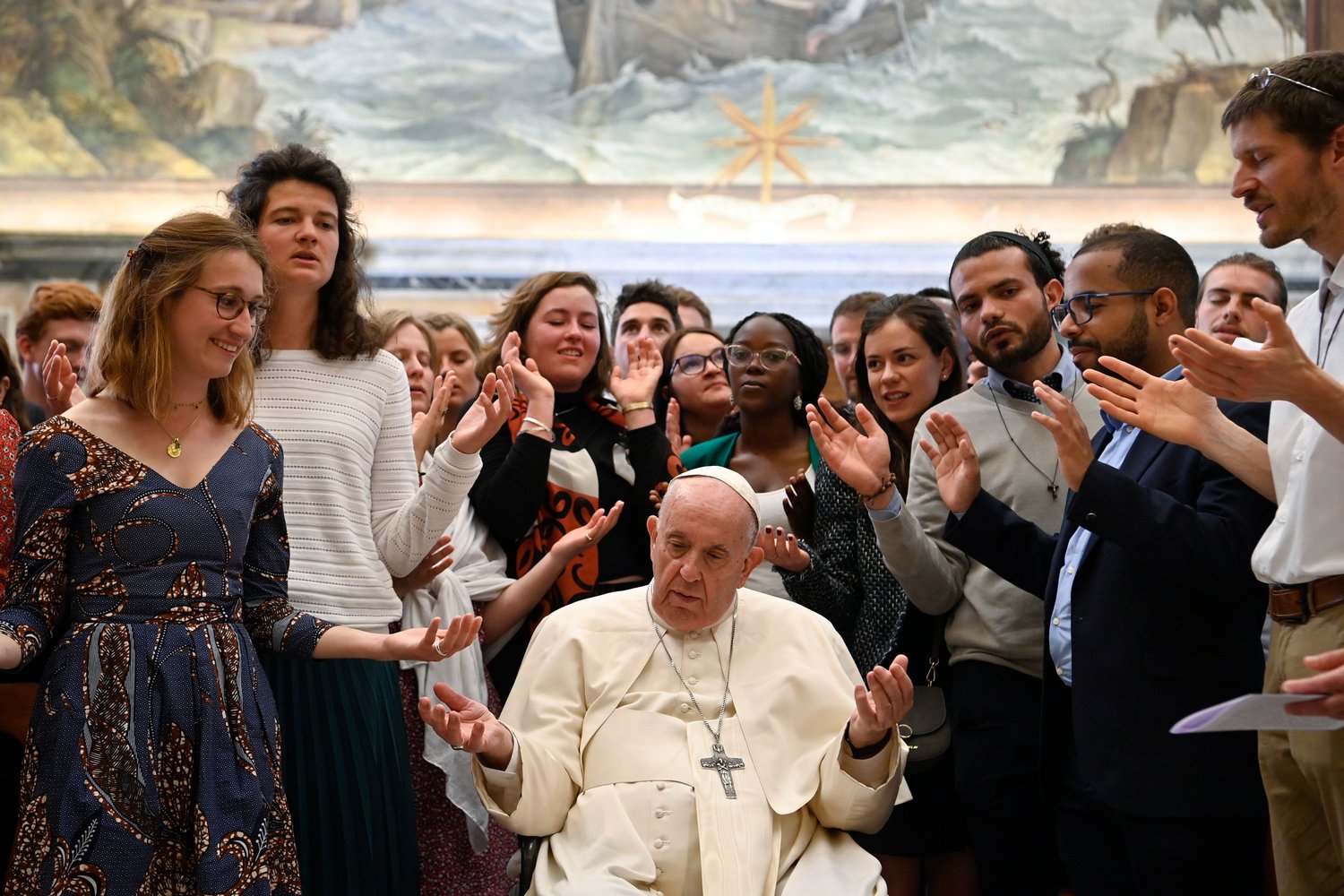 Pope Francis and members of the "Political Fraternity" project of the Chemin Neuf lay movement pray together at the end of an audience May 16, 2022, in the Clementine Hall of the Apostolic Palace at the Vatican. (CNS photo/Vatican Media)