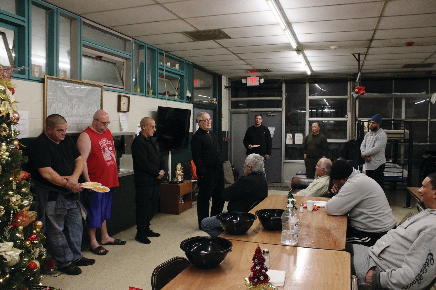 Bishop Thomas J. Tobin visited the diocesan Emmanuel House homeless shelter on December 19 to lead a short prayer service where he offered a blessing upon shelter guests and presented them with gifts at the annual Christmas party. Emmanuel House, which helps provide shelter for approximately 20,000 people per year, is also to some extent a community effort. Although founded and operated by the diocese, those involved with the shelter will frequently work with local government leaders to help carry out its mission.