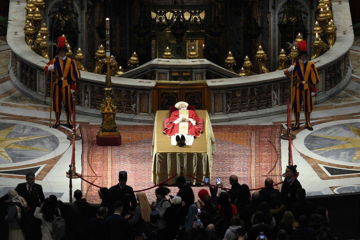 The body of Pope Benedict XVI lies in St. Peter's Basilica for public viewing at the Vatican Jan. 2, 2023.