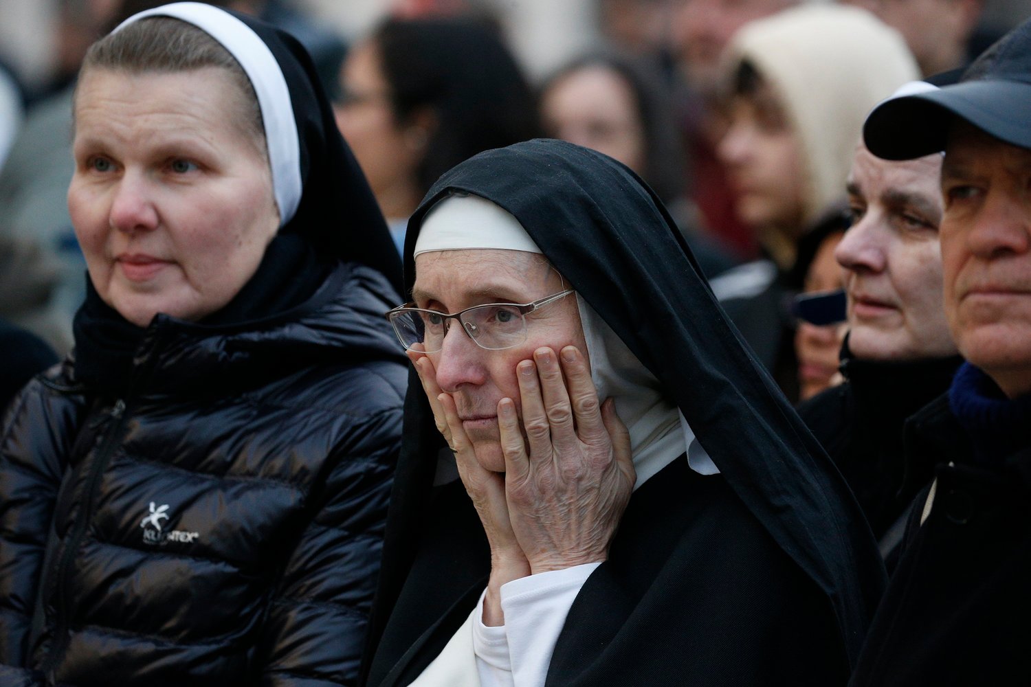 A nun reacts in St. Peter's Square at the Vatican before Pope Francis' celebration of the funeral Mass of Pope Benedict XVI Jan. 5, 2023. (CNS photo/Paul Haring)