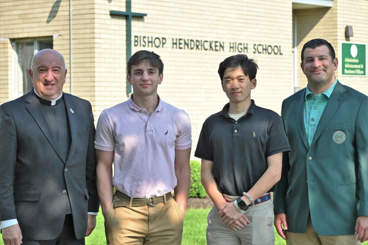 Two seniors from Bishop Hendricken High School have earned appointments to the U.S. Air Force & U.S. Naval Academies. Pictured from left, Father Robert L. Marciano, president, Christien Monello, Robert Connor Shao, Mark DeCiccio, principal.