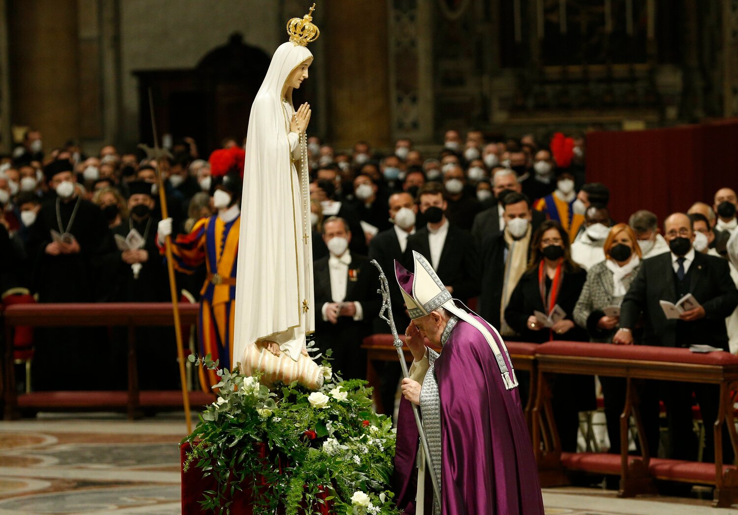 Pope Francis makes the sign of the cross in front of a Marian statue after consecrating the world and, in particular, Ukraine and Russia to the Immaculate Heart of Mary during a Lenten penance service in St. Peter's Basilica at the Vatican March 25, 2022.