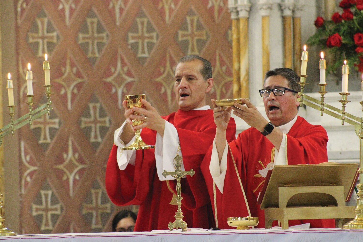 Parishioners and clergy of St. Charles Borromeo Church in Providence celebrate the Solemnity of Pentecost on Sunday, May 28. This Mass comes on the heels of an all-night prayer service that took place in preparation for the Solemnity of Pentecost.