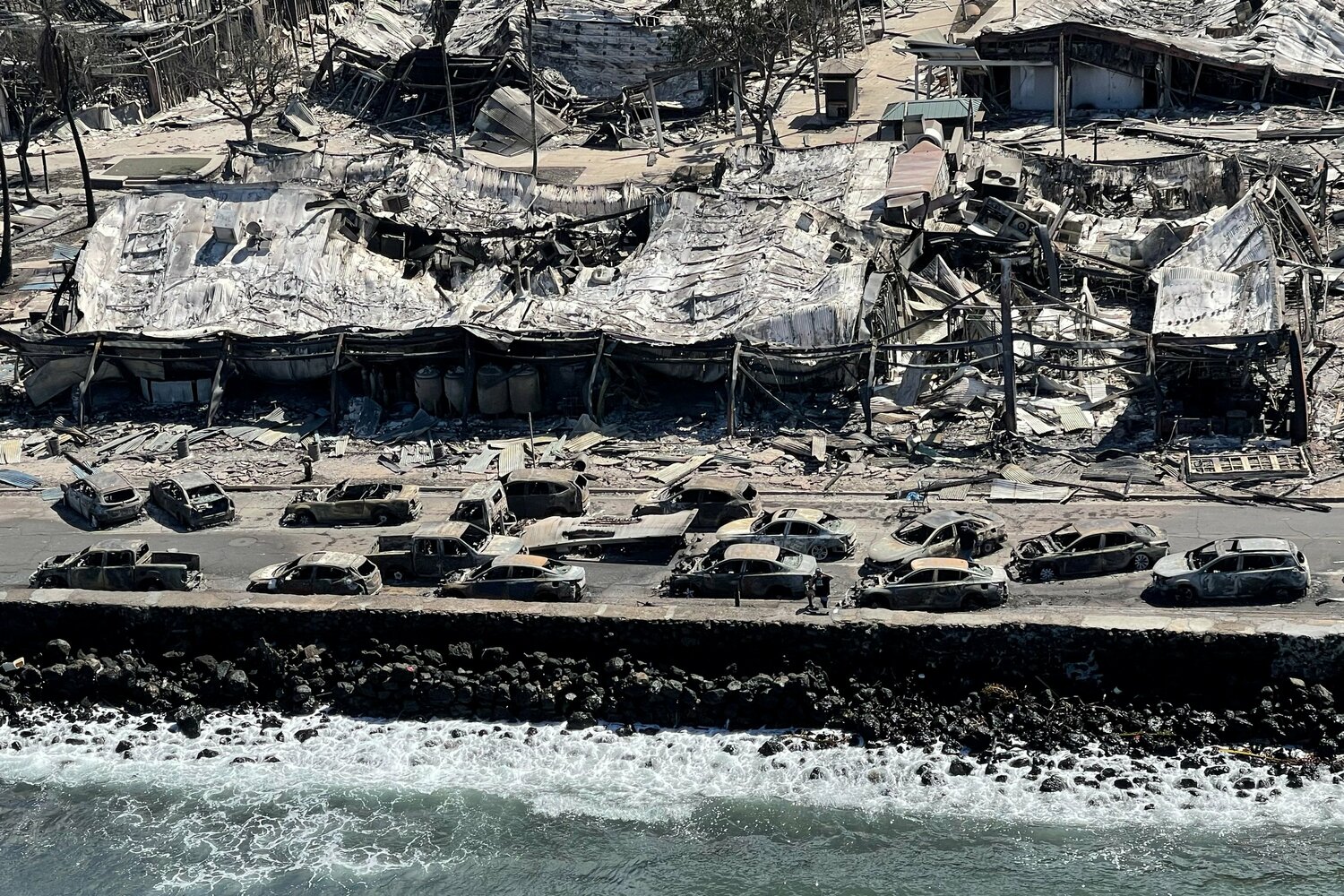 The shells of burned houses and buildings are left after wildfires driven by high winds burned across most of the town in Lahaina, Hawaii, Aug. 11, 2023. Lahaina’s Maria Lanakila Catholic Church was spared from the flames that wiped out most of the surrounding community.