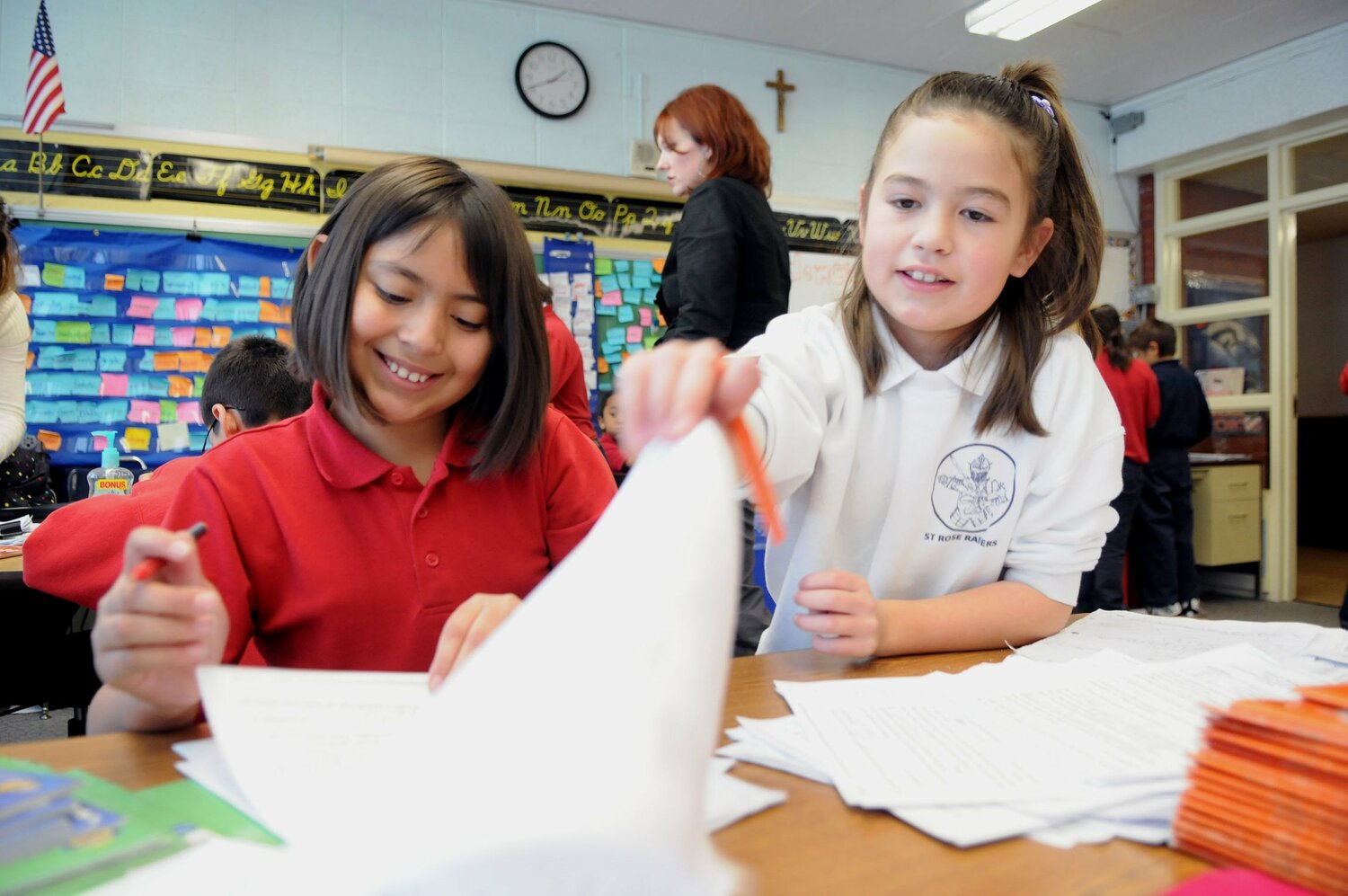 Students Evangelina Romero and Samantha Cabral at St. Rose of Lima School in Denver, work on a project in this file photo dated Dec. 12, 2009. (OSV News photo/James Baca, Denver Catholic Register)