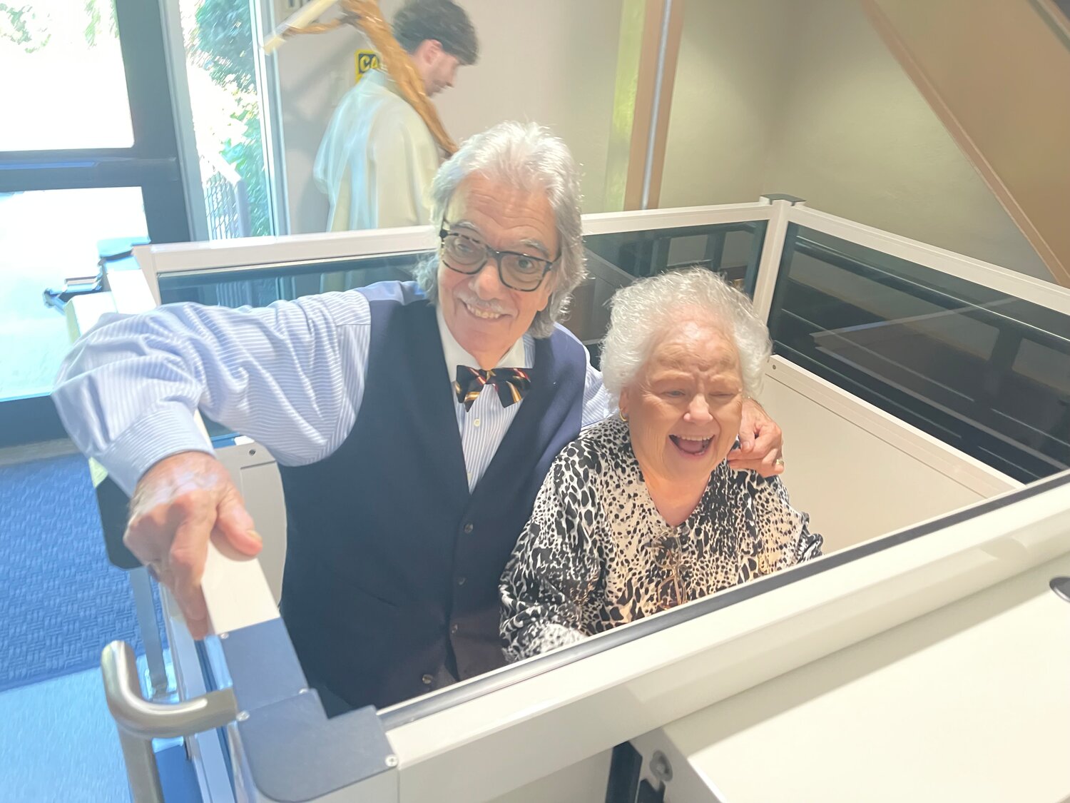 Bill and Maureen Fenner use the church’s new vertical platform lift system to access the anniversary luncheon in the parish hall following the Mass.