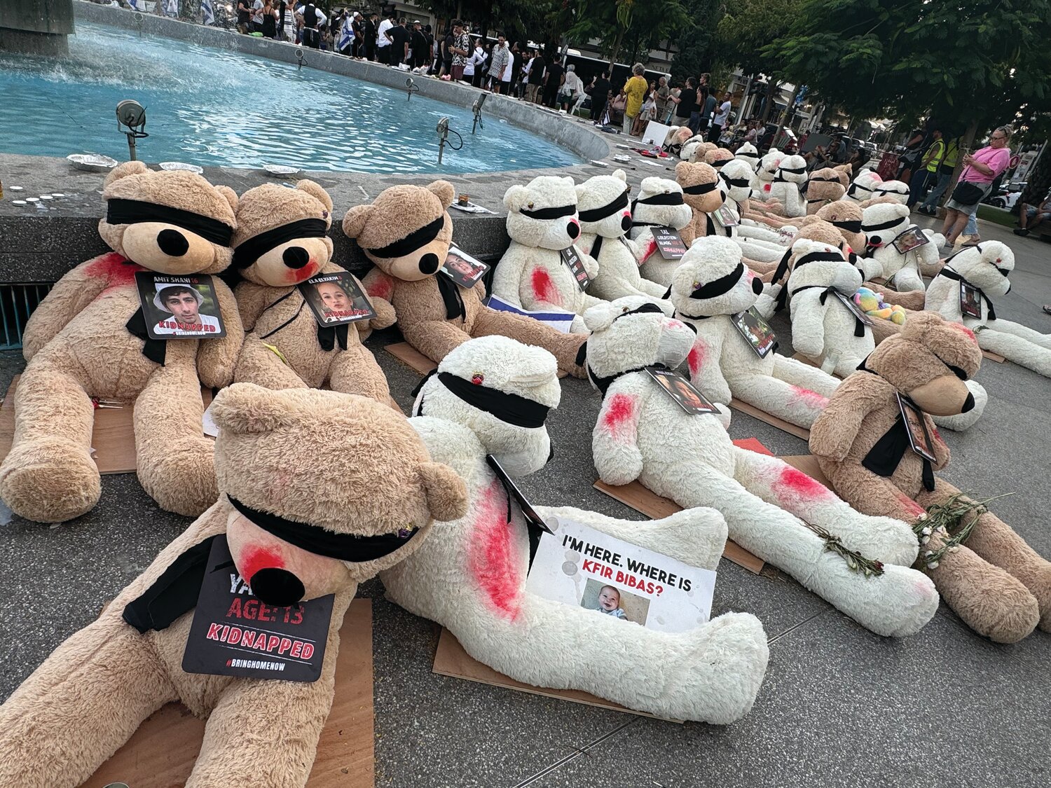 A display of 30 blindfolded teddy bears, each representing one of the children kidnapped by Hamas terrorists on Oct. 7 and taken back to the Gaza Strip, where they are being held hostage, draws thousands each day to Tel Aviv’s Dizengoff Square. Each bear has a photo, name and age of one of the child hostages.