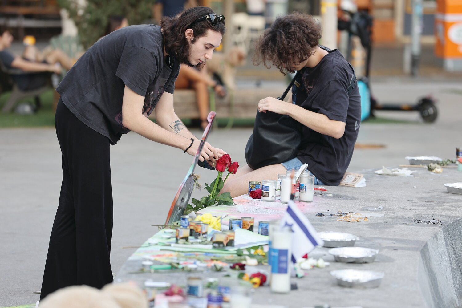 Israelis visit memorials created at Tel Aviv’s Dizengoff Square to remember the 240 in captivity, including 30 children, as well as the 1,200 killed in the Oct. 7 terror attacks.